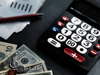 Money and Calculator on a Desk